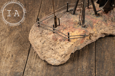 Vintage Oil Pumpjack Model on Stone