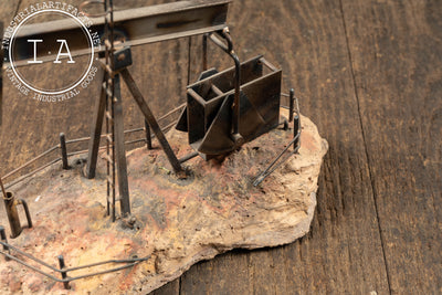 Vintage Oil Pumpjack Model on Stone