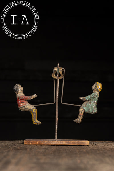 Early Tin Litho Swinging Toy by Gibbs