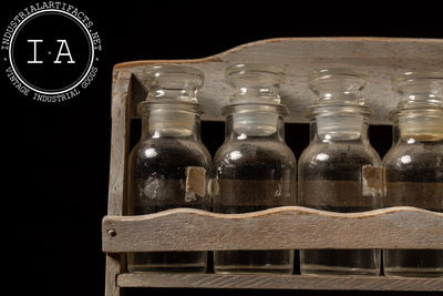 Early Apothecary Bottle Rack with Twelve Glass Stoppered Vials