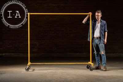 Vintage Industrial Pipe Rolling Garment Rack in Yellow