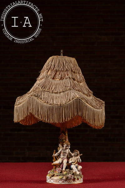 Antique Dresden-Style Porcelain Figural Cherub Lamp with Tiered Fringe Shade