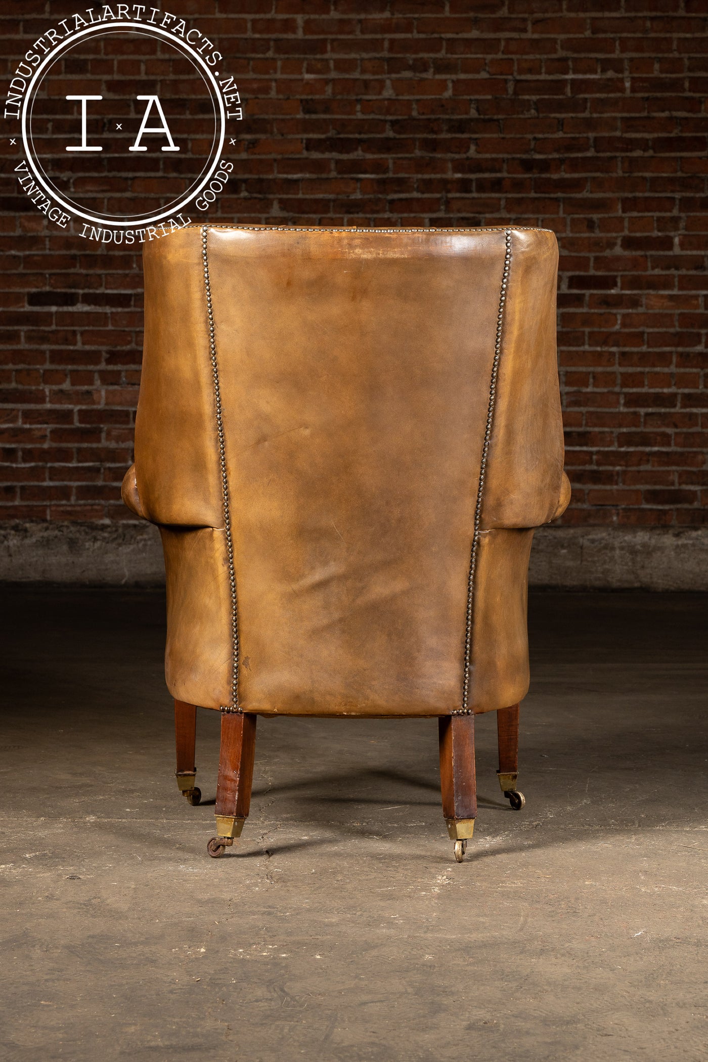 Mid-Century Leather High-Wingback Rolling Armchair In Brown
