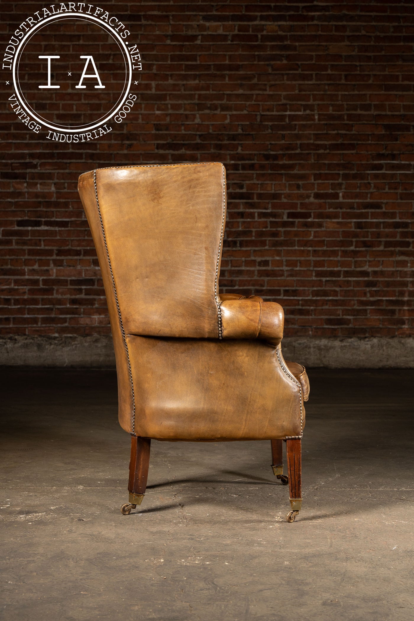Mid-Century Leather High-Wingback Rolling Armchair In Brown