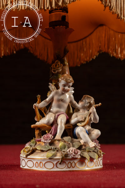Antique Dresden-Style Porcelain Figural Cherub Lamp with Tiered Fringe Shade