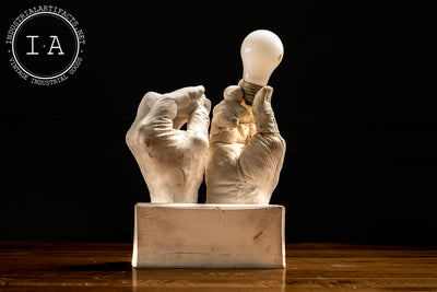 Contemporary Hands and Light Bulb Sculpture