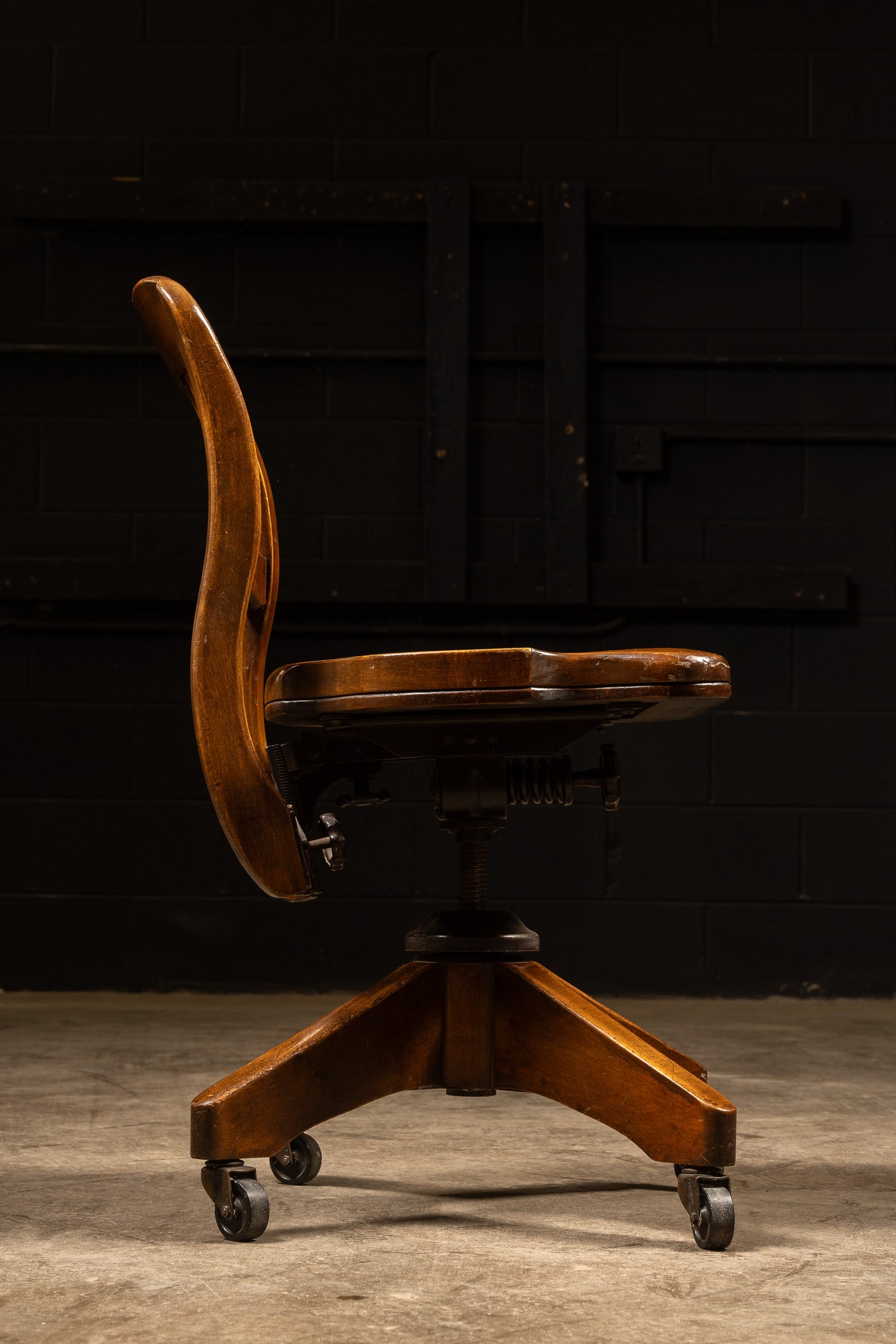 Antique Wooden Rolling Banker's Chair