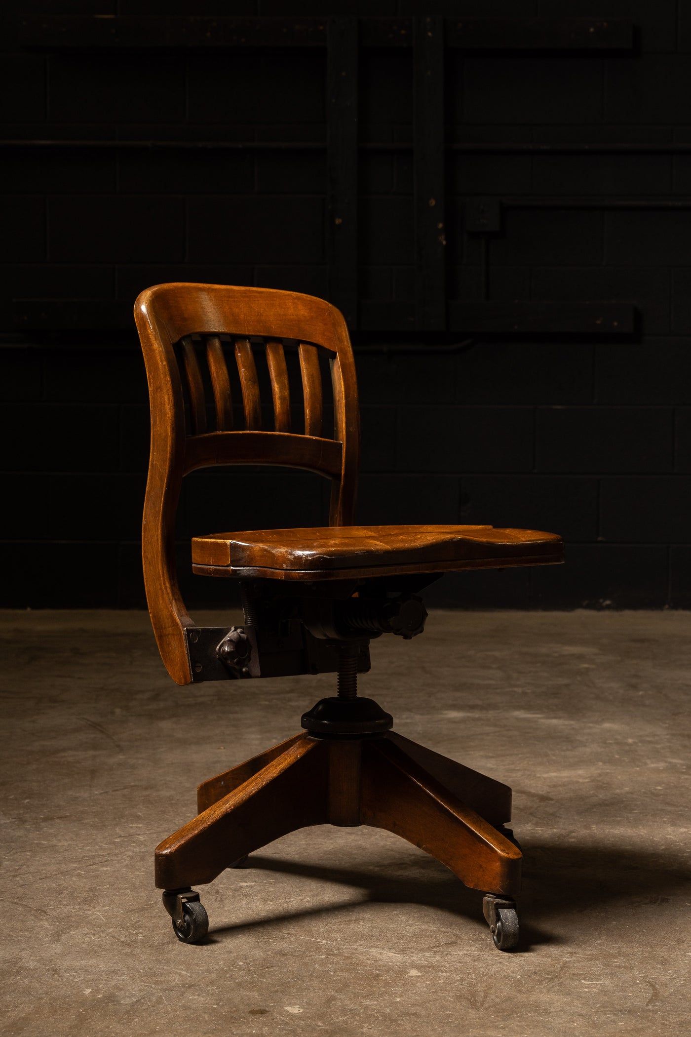 Antique Wooden Rolling Banker's Chair