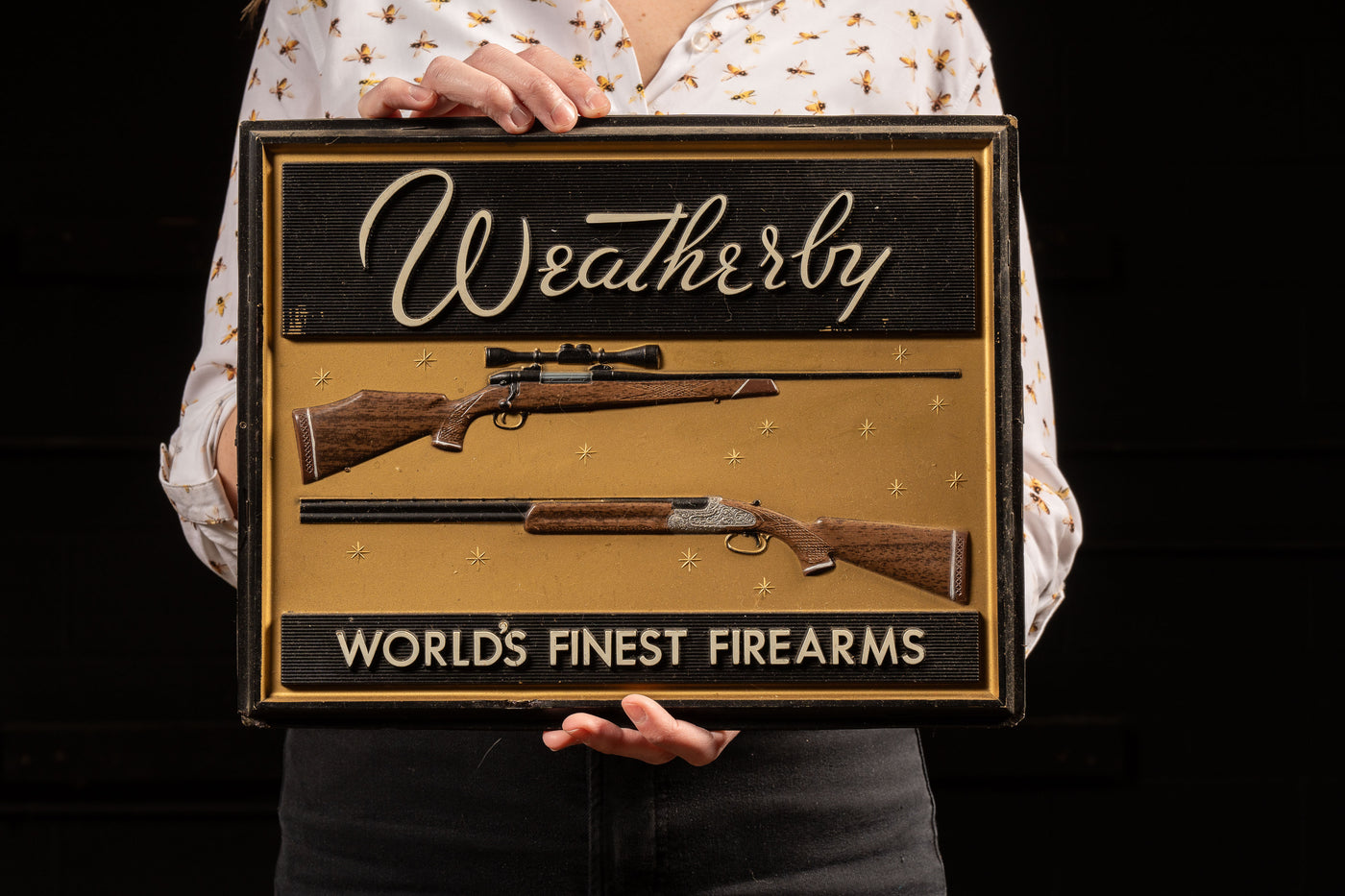 Vintage Weatherby Firearms Embossed Plastic Sign
