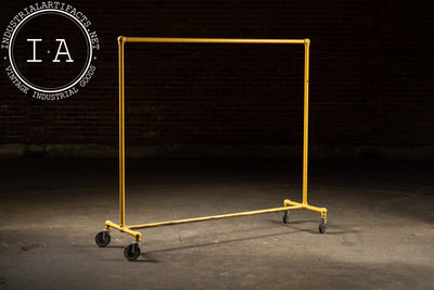 Vintage Industrial Pipe Rolling Garment Rack in Yellow