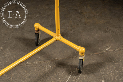 Vintage Industrial Pipe Rolling Garment Rack in Yellow