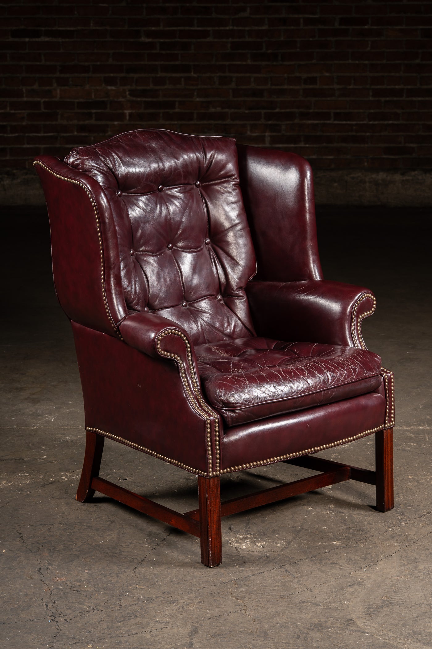 Tufted Leather Wingback Chesterfield Armchair with Ottoman in Oxblood