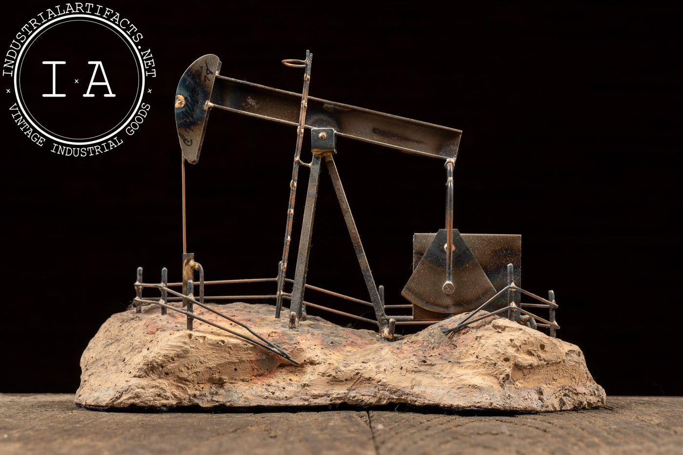Vintage Oil Pumpjack Model on Stone
