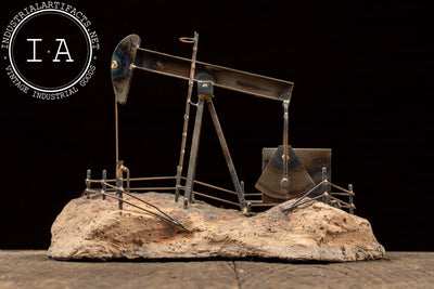 Vintage Oil Pumpjack Model on Stone