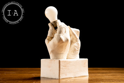 Contemporary Hands and Light Bulb Sculpture