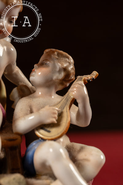 Antique Dresden-Style Porcelain Figural Cherub Lamp with Tiered Fringe Shade
