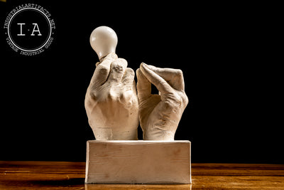 Contemporary Hands and Light Bulb Sculpture