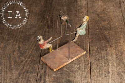 Early Tin Litho Swinging Toy by Gibbs