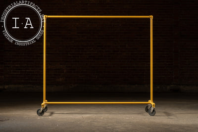 Vintage Industrial Pipe Rolling Garment Rack in Yellow