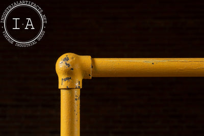 Vintage Industrial Pipe Rolling Garment Rack in Yellow