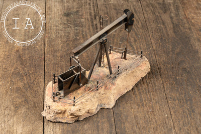 Vintage Oil Pumpjack Model on Stone