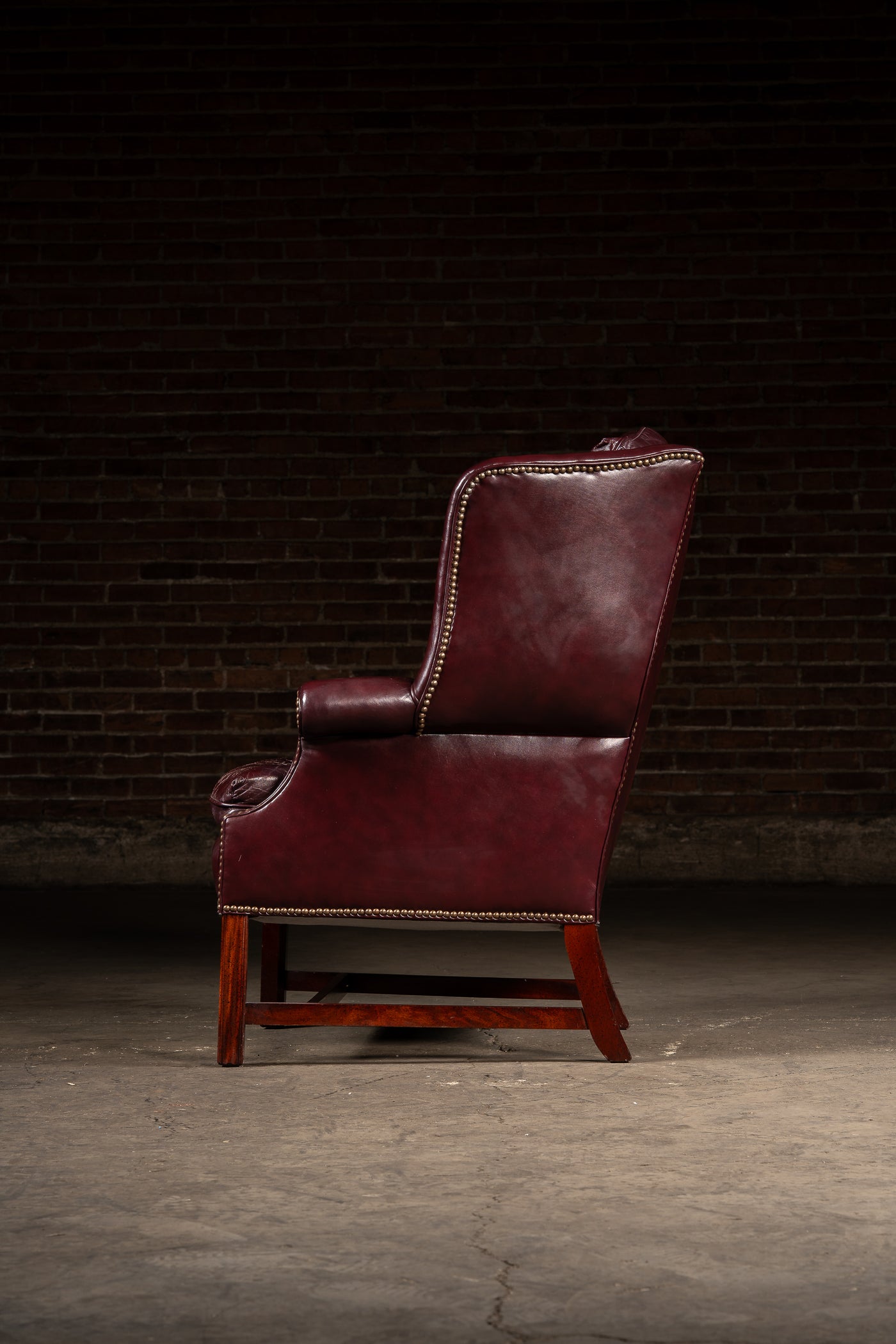 Tufted Leather Wingback Chesterfield Armchair with Ottoman in Oxblood