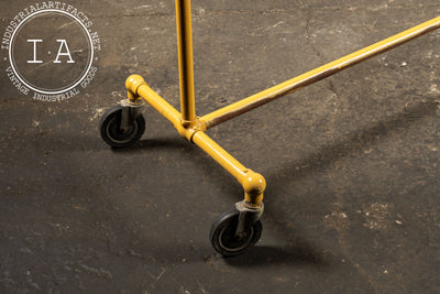 Vintage Industrial Pipe Rolling Garment Rack in Yellow