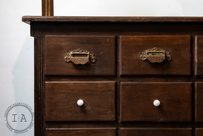 C. 1920 Wooden Apothecary Cabinet With Ornate Cast Iron Drawer Pulls