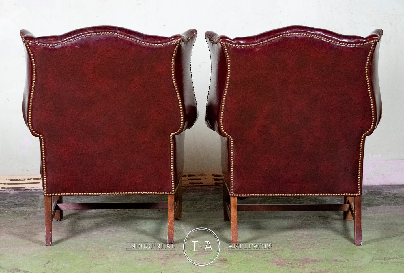 Pair Of Vintage Aged Oxblood Wingback Chairs